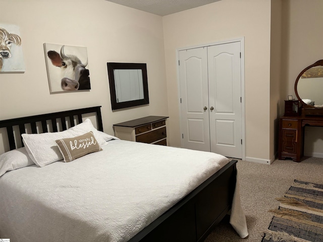 carpeted bedroom featuring a closet