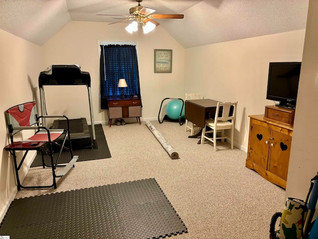 workout area featuring lofted ceiling, carpet, and ceiling fan