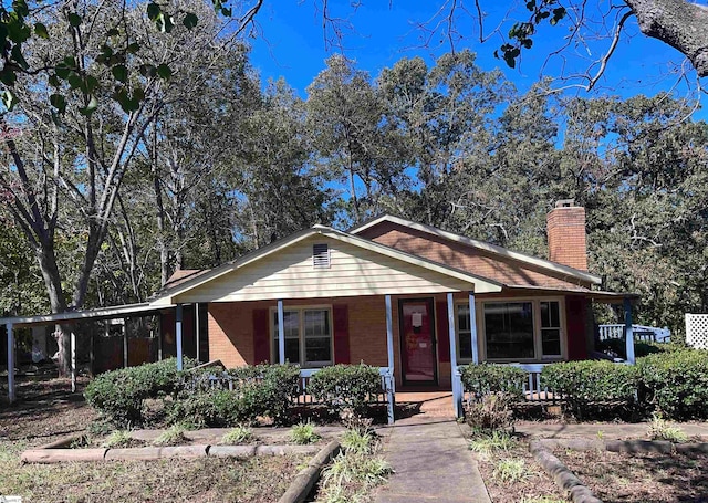 ranch-style house featuring covered porch