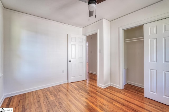 unfurnished bedroom featuring light hardwood / wood-style flooring, a closet, and ceiling fan