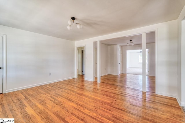 empty room with light hardwood / wood-style flooring