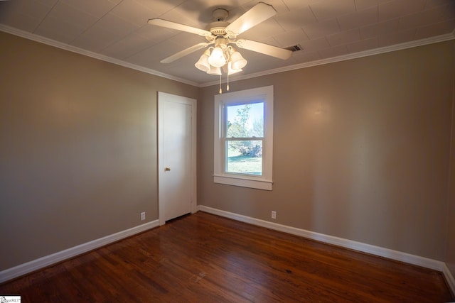 spare room featuring ceiling fan, ornamental molding, and dark hardwood / wood-style floors