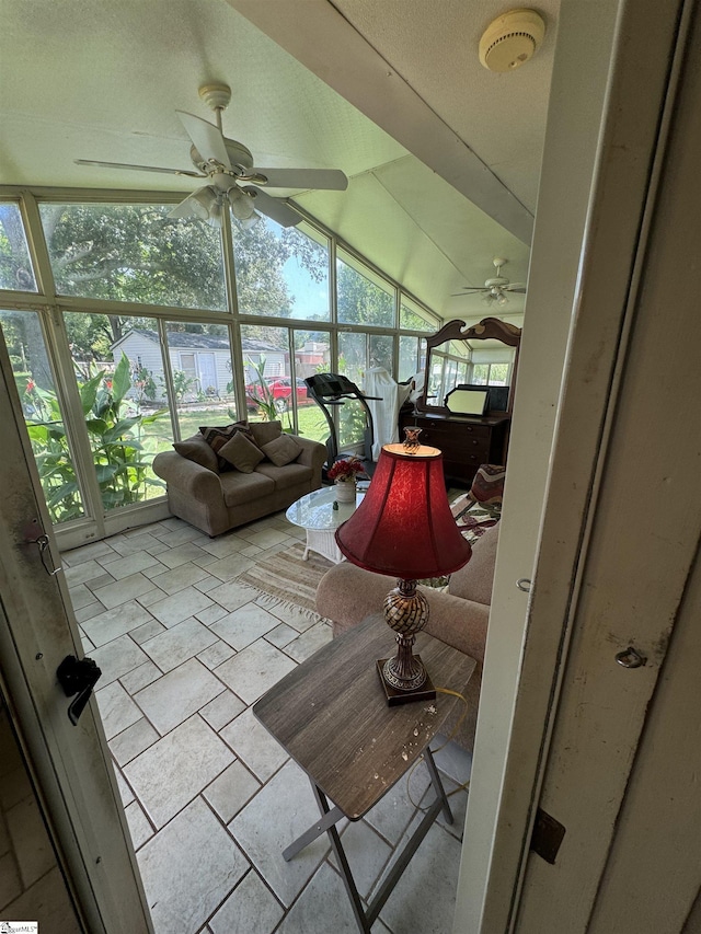 sunroom with vaulted ceiling and ceiling fan