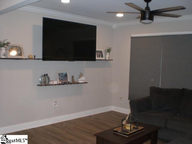 living room with crown molding, hardwood / wood-style flooring, and ceiling fan