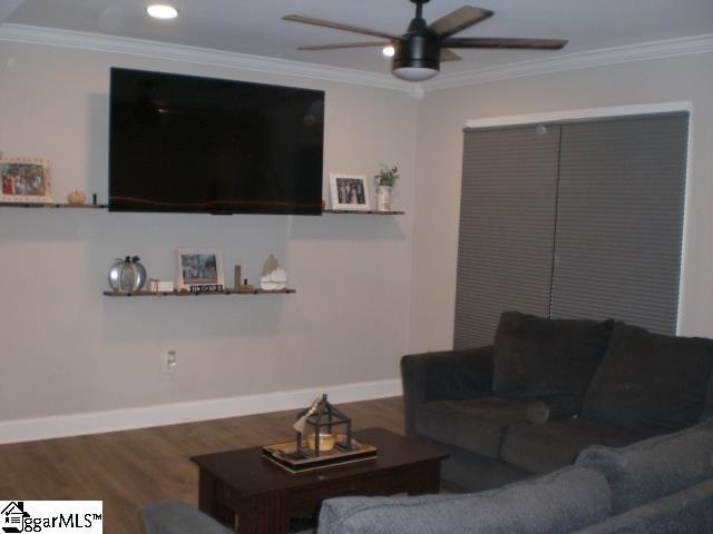 living room with ceiling fan, ornamental molding, and hardwood / wood-style floors