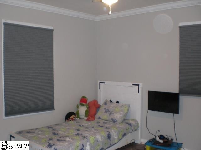 bedroom featuring ornamental molding