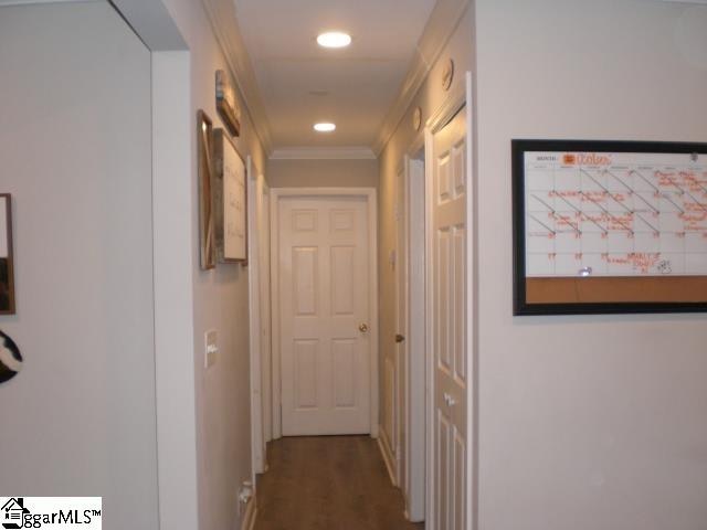 corridor featuring crown molding