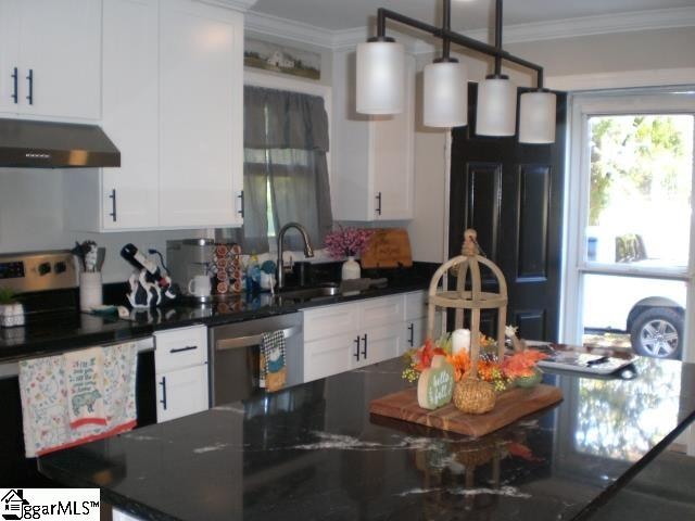 kitchen with white electric range, white cabinetry, sink, and range hood