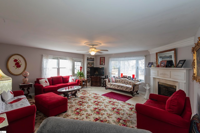 carpeted living room with ceiling fan