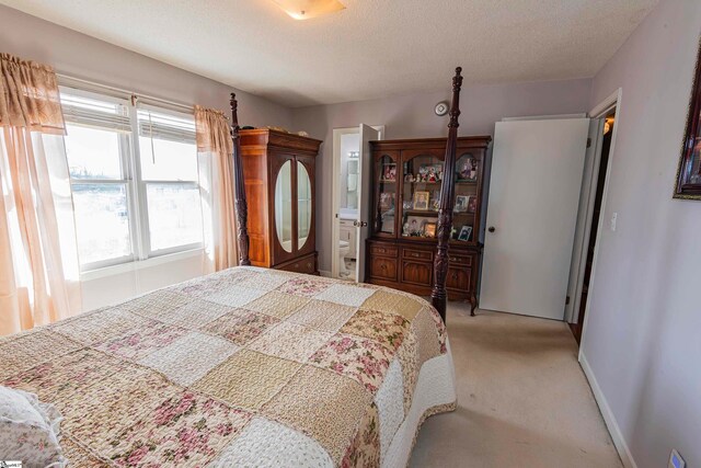 carpeted bedroom with a textured ceiling