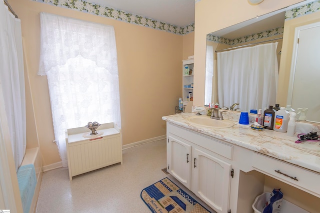 bathroom with vanity and radiator