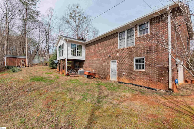 rear view of house with a yard