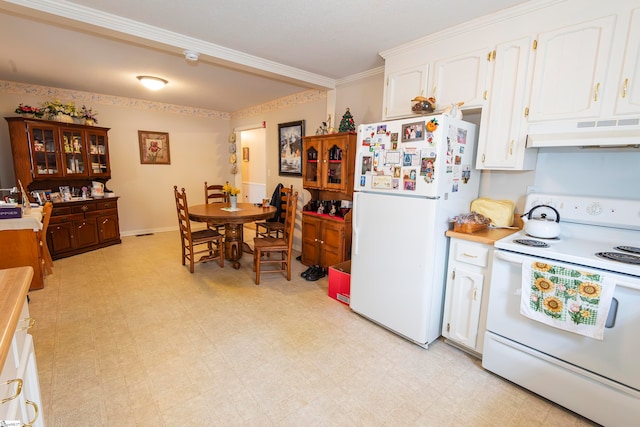 kitchen featuring white appliances, custom range hood, crown molding, and white cabinetry