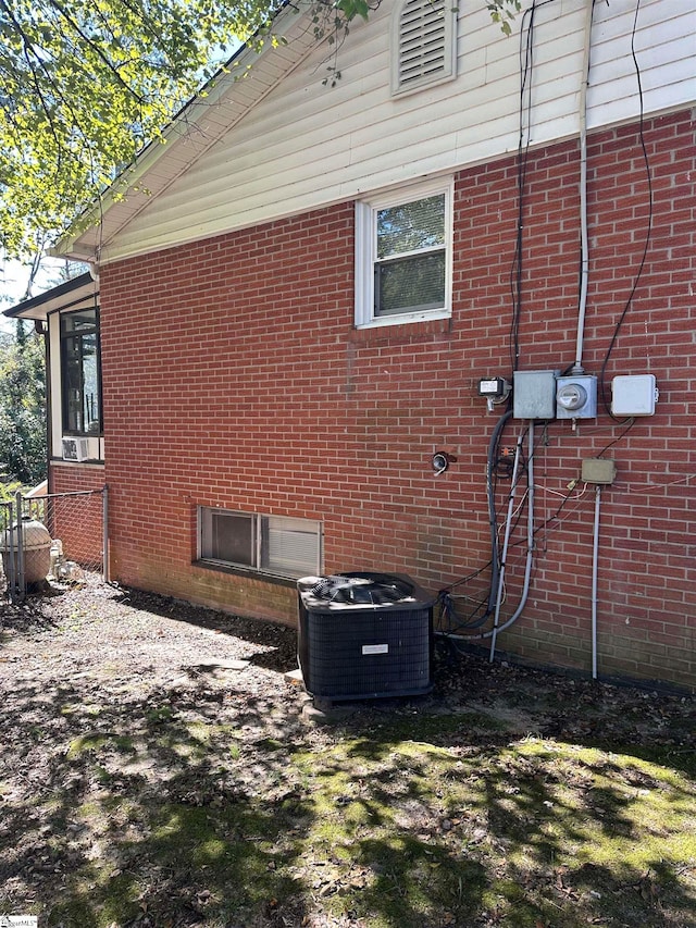 view of home's exterior with central AC