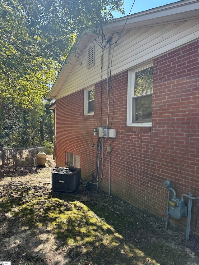 view of property exterior with central AC