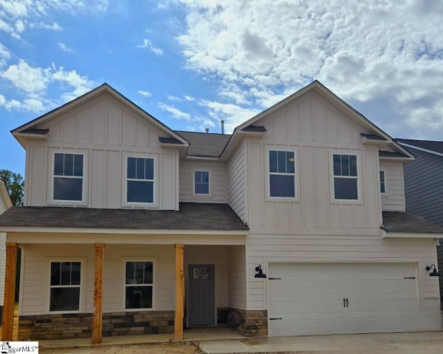 view of front facade with a garage and a porch