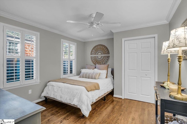 bedroom featuring ornamental molding, wood-type flooring, and ceiling fan