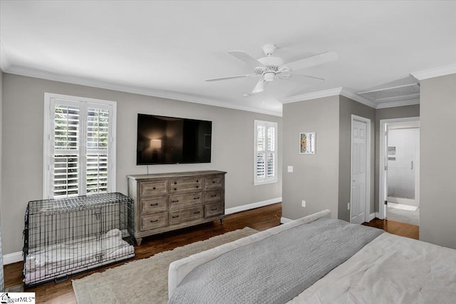 bedroom with dark wood-type flooring, ceiling fan, crown molding, and ensuite bathroom