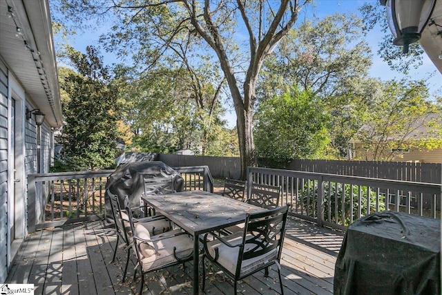 wooden terrace with area for grilling