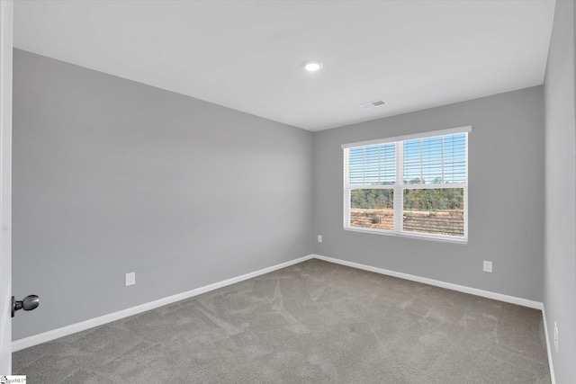 unfurnished room featuring carpet