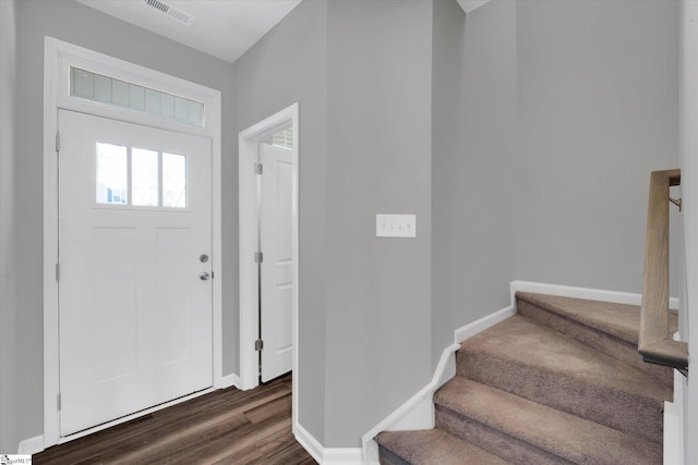 foyer entrance with dark hardwood / wood-style floors