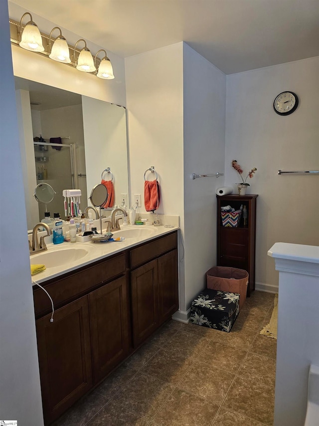 bathroom featuring vanity, walk in shower, and tile patterned flooring