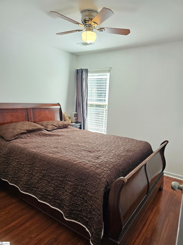 bedroom with wood-type flooring and ceiling fan