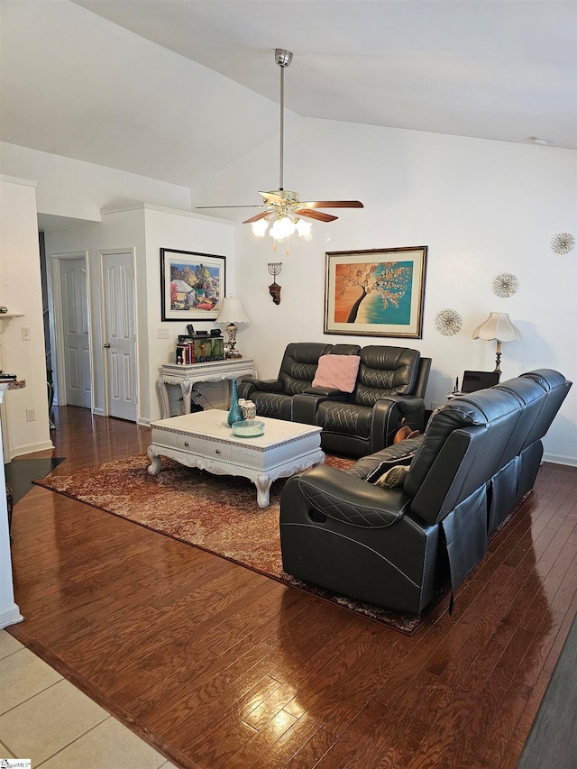 living room with ceiling fan, wood-type flooring, and vaulted ceiling