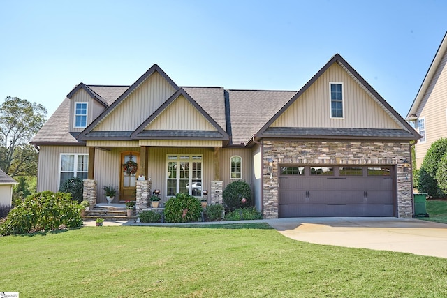 craftsman-style house featuring a front lawn and a garage