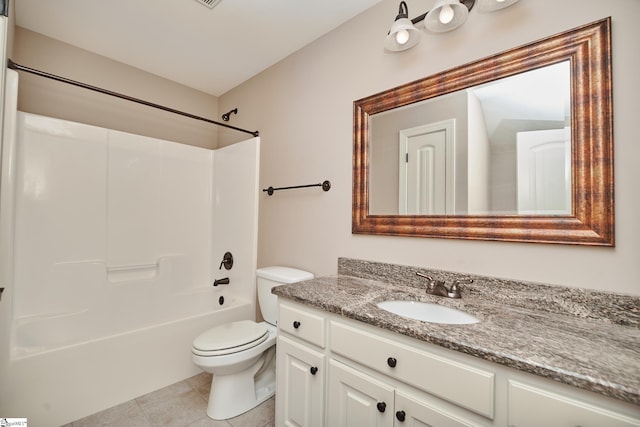 full bathroom featuring vanity, toilet, tile patterned floors, and bathing tub / shower combination