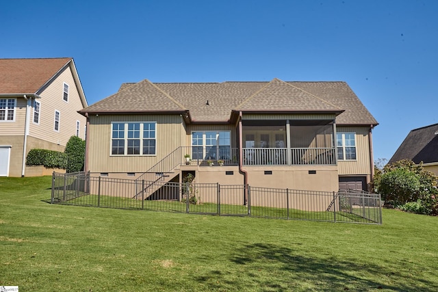 back of house with a lawn and a sunroom