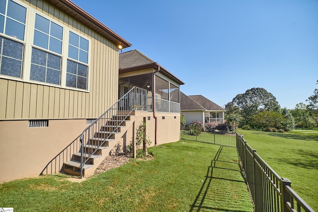 view of yard with a sunroom