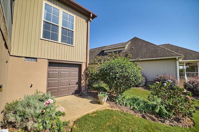 view of property exterior with a garage