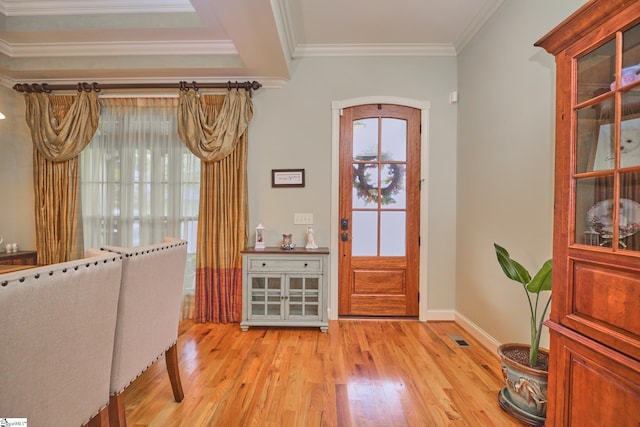 foyer featuring light hardwood / wood-style floors and crown molding