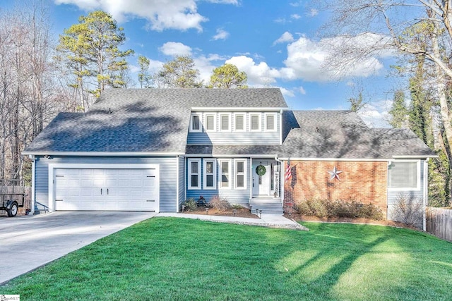 view of front of house featuring a front lawn and a garage