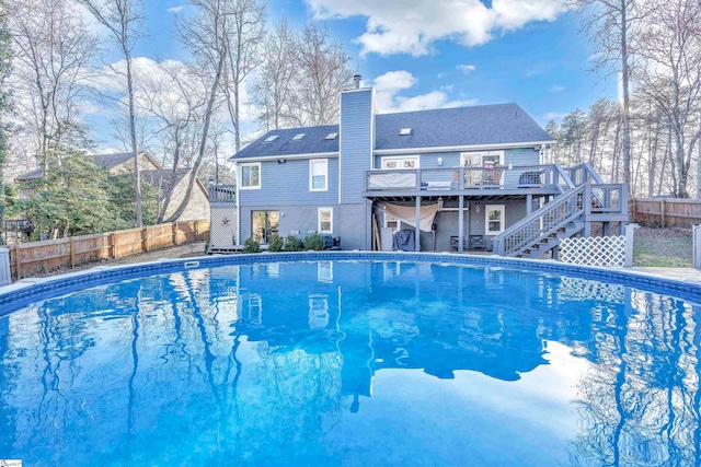 view of swimming pool featuring a deck