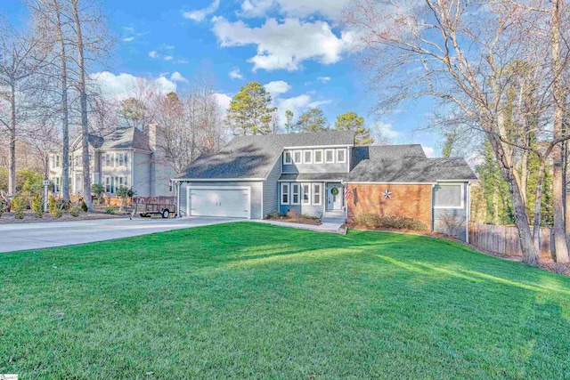 front of property with a front yard and a garage