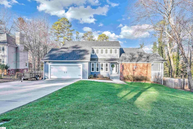 view of front facade with a front yard and a garage