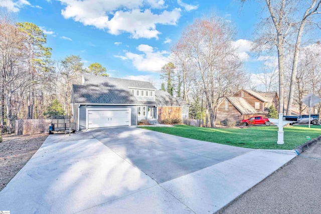 view of front of house featuring a front yard and a garage