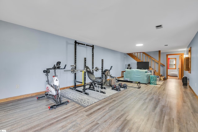 exercise room featuring light hardwood / wood-style flooring