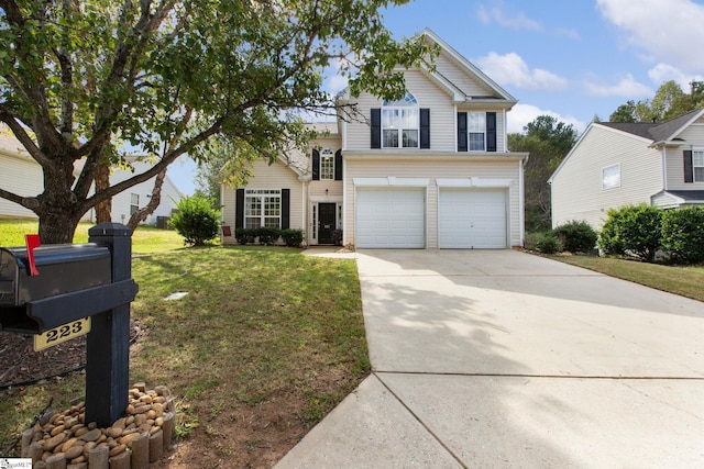 view of front of house with a front lawn and a garage