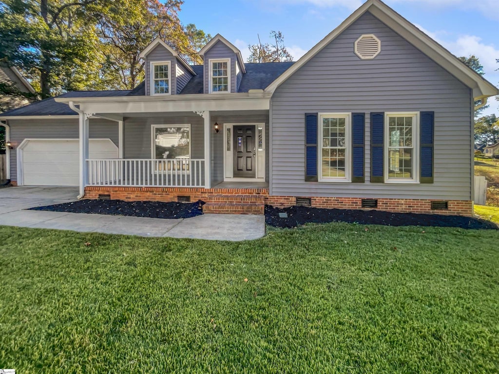 cape cod house featuring a porch, a front lawn, and a garage