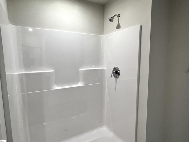 bathroom with a shower stall