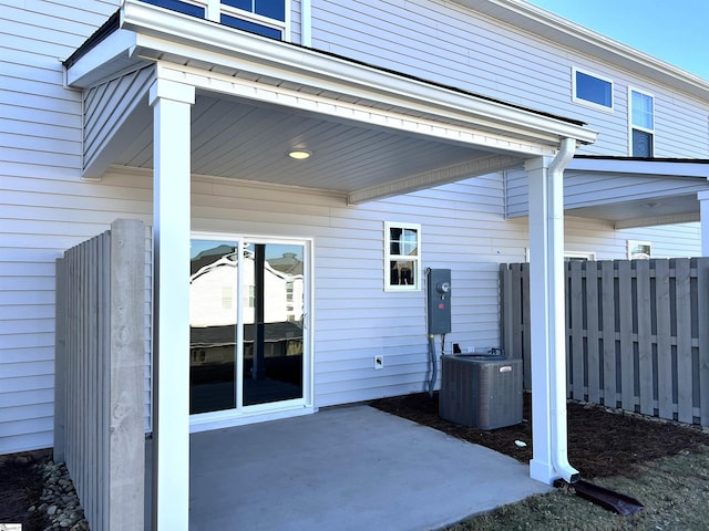 view of patio featuring fence and cooling unit