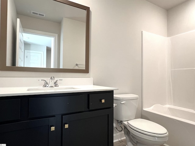 bathroom with toilet, visible vents, shower / tub combination, and vanity