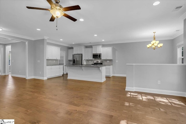 unfurnished living room with sink, crown molding, light hardwood / wood-style flooring, and ceiling fan with notable chandelier