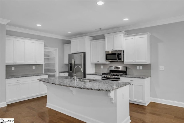 kitchen with sink, appliances with stainless steel finishes, white cabinets, and dark hardwood / wood-style flooring