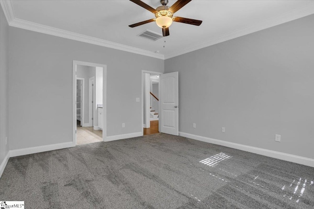 unfurnished bedroom with ceiling fan, light carpet, ornamental molding, and ensuite bathroom