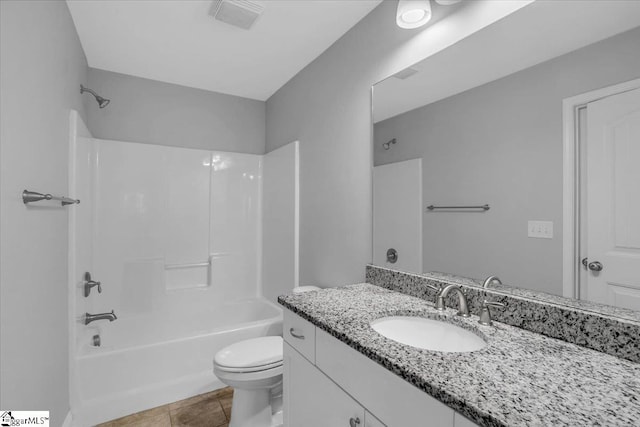 full bathroom with vanity, toilet, tile patterned floors, and  shower combination