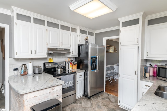 kitchen featuring white cabinets, backsplash, appliances with stainless steel finishes, ornamental molding, and light stone counters